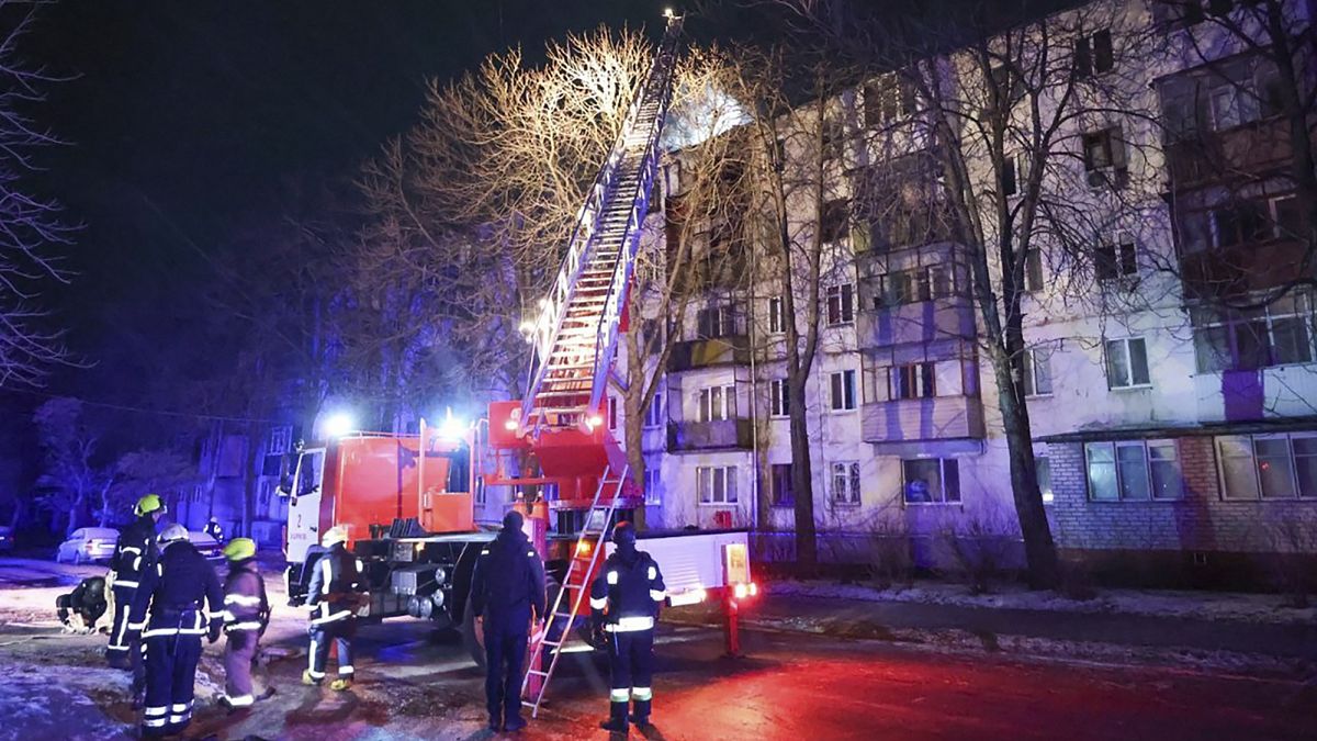 Firefighters work on the site of a damaged building after a Russian drone attack in Kharkiv, 13 December, 2024