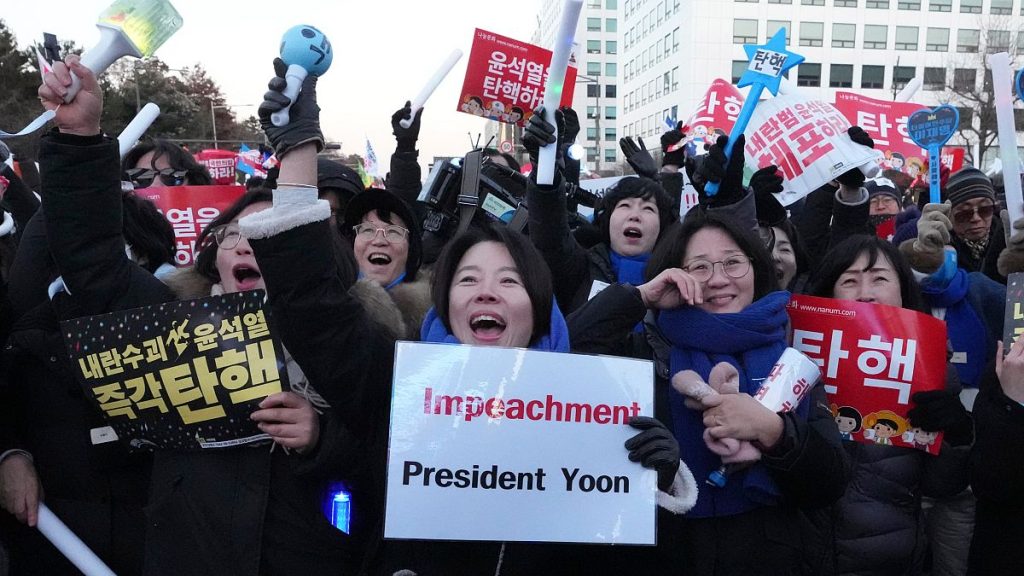 Participants react after hearing the news that South Korea