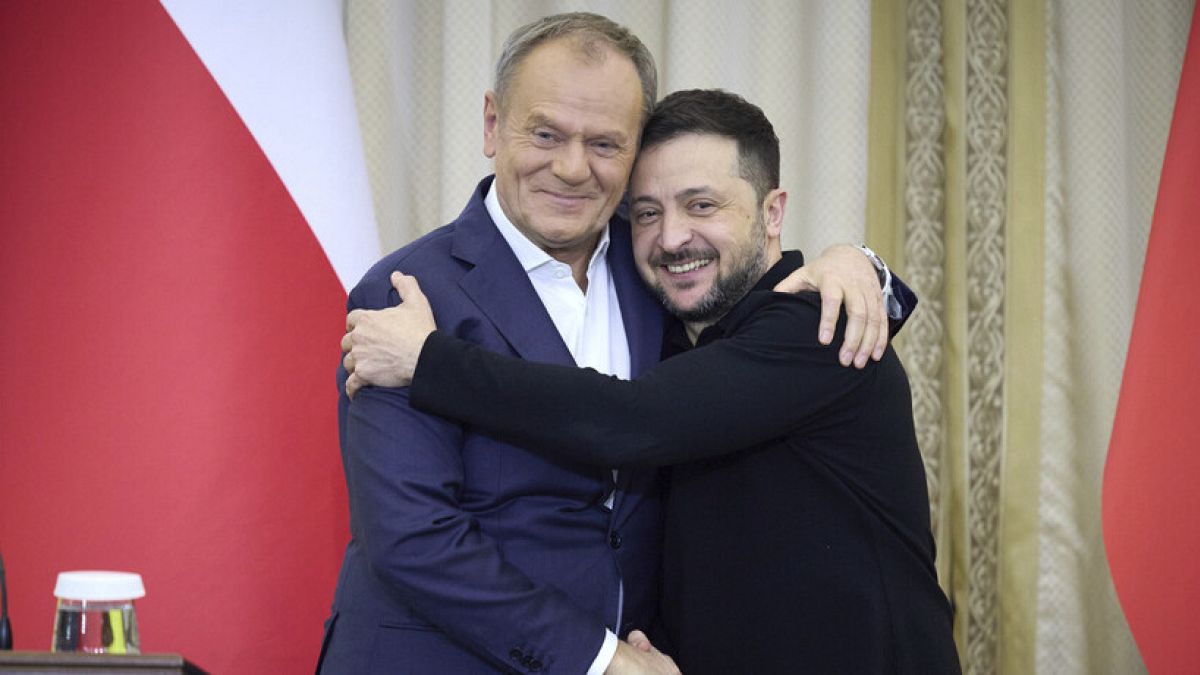 Ukrainian President Volodymyr Zelenskyy, right, shakes hands with Polish Prime Minister Donald Tusk in Lviv, Ukraine, Tuesday, Dec. 17, 2024