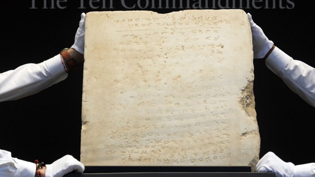 The oldest complete tablet of the Ten Commandments, weighing 115-pounds and approximately 1,500 years old, displayed at Sotheby