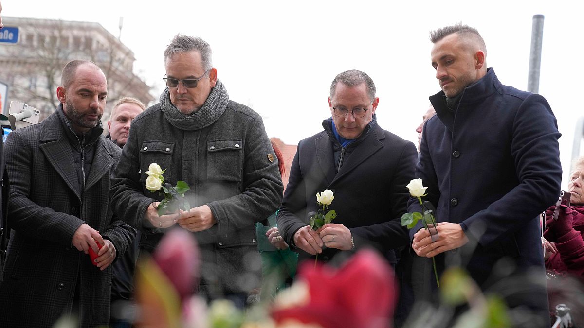 Leader of AfD party Tino Chrupalla pays tribute to victims outside St. John