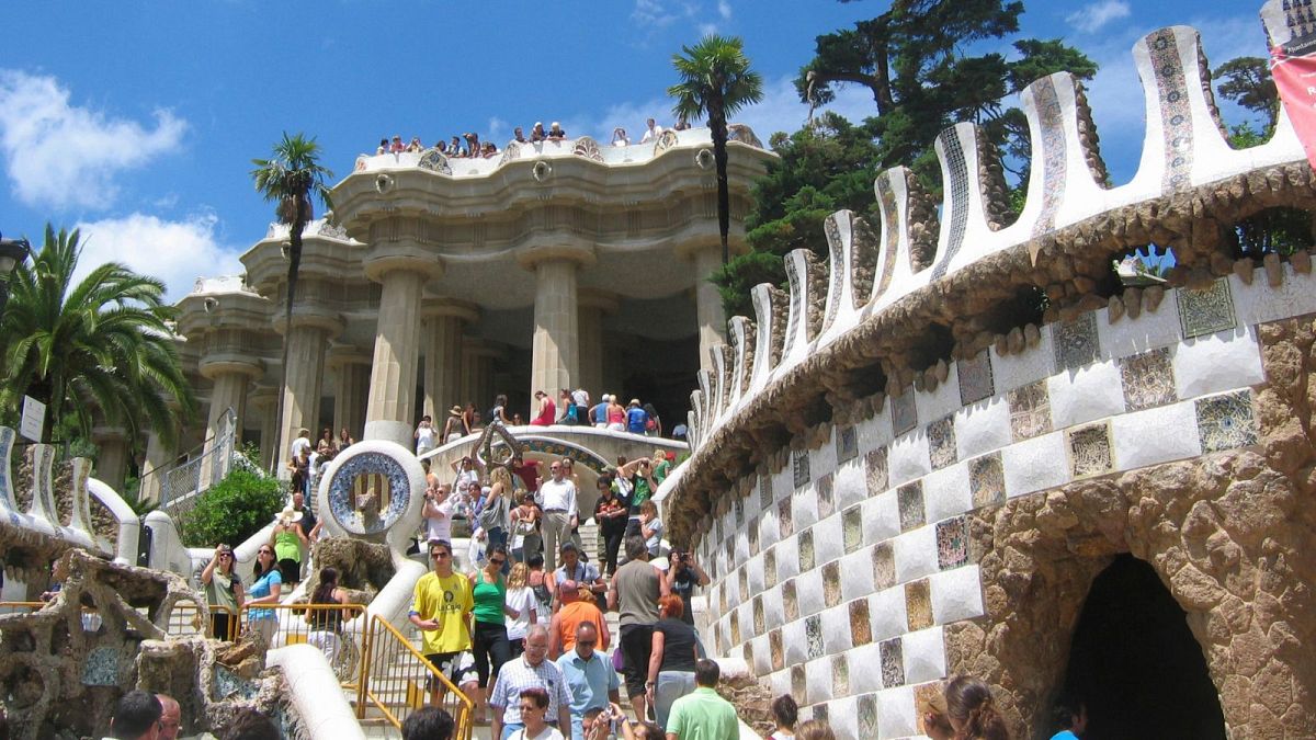 Visitors stroll around Park Guell in Barcelona, Spain.