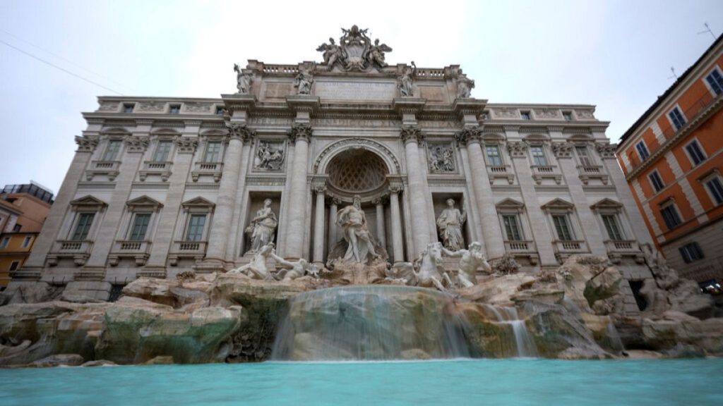 Frontal view of the Trevi fountain, which reopened to the public after undergoing maintenance in Rome, Sunday, Dec. 22, 2024.