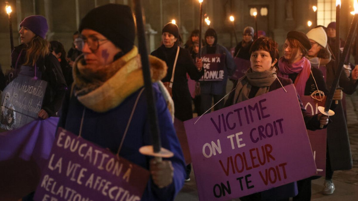 Activists of the feminist group NousToutes stage a demonstration outside the Louvre calling for better justice for rape victims after 50 men were convicted of raping Pelicot