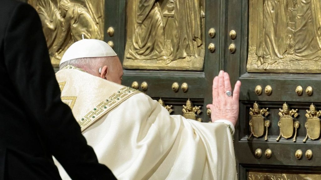 Pope Francis opens the Holy Door to mark the opening of the 2025 Catholic Holy Year, or Jubilee, in St. Peter