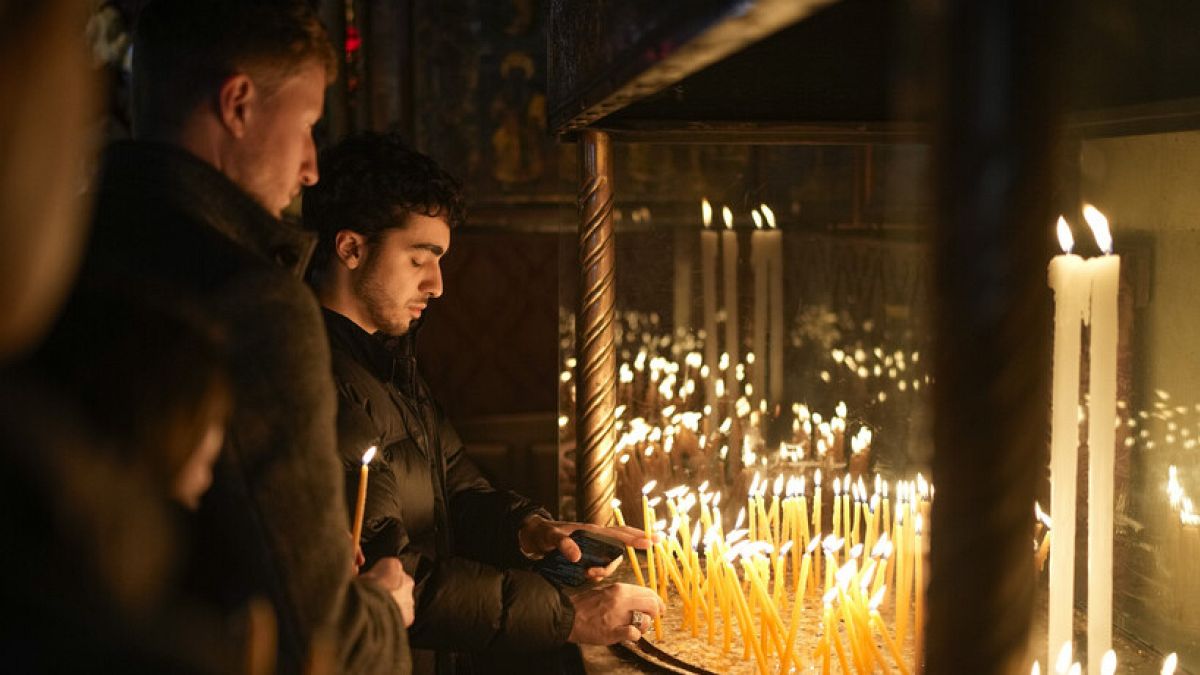 Faithful pray at the Church of the Nativity, traditionally believed to be the birthplace of Jesus, in the West Bank city of Bethlehem, Tuesday, Dec. 24, 2024