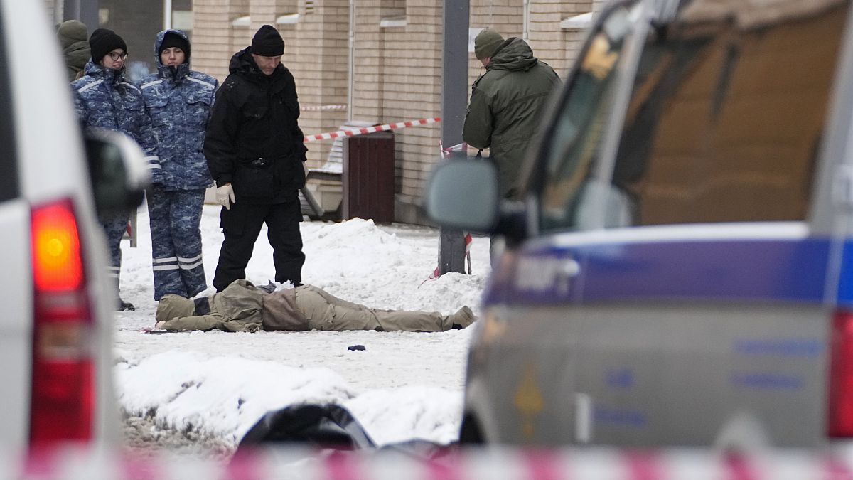 Investigators work the site where Igor Kirillov was killed by a bomb hidden in a scooter outside his apartment building in Moscow, 17 December, 2024