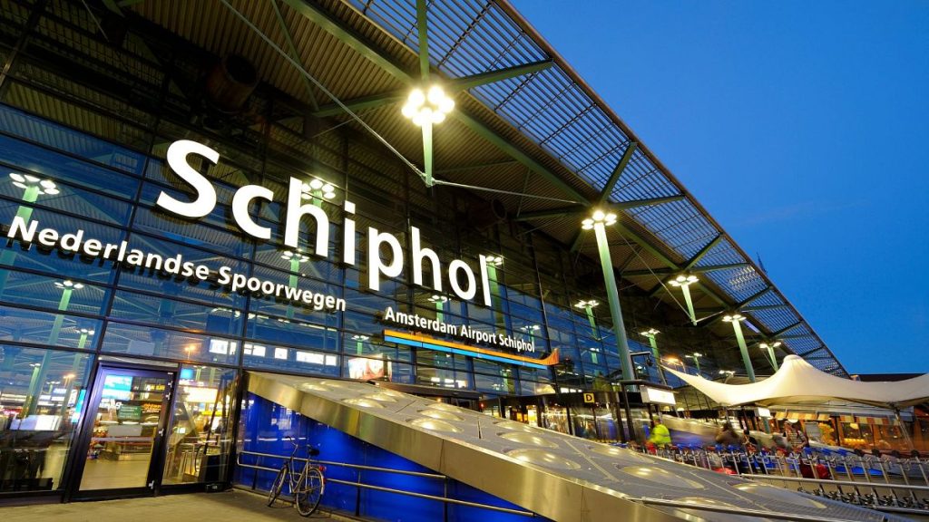 Illuminated entrance of Airport Schiphol airport in Amsterdam