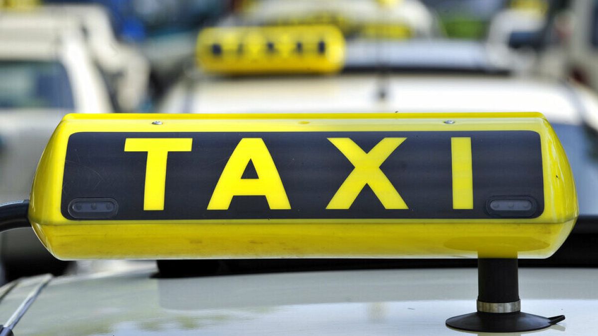 FILE - In this June 15, 2009 file photo taxi cabs are seen at Tegel Airport in Berlin, Germany