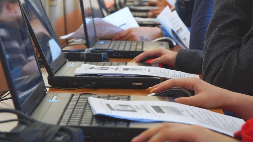 Students work on computers in class.