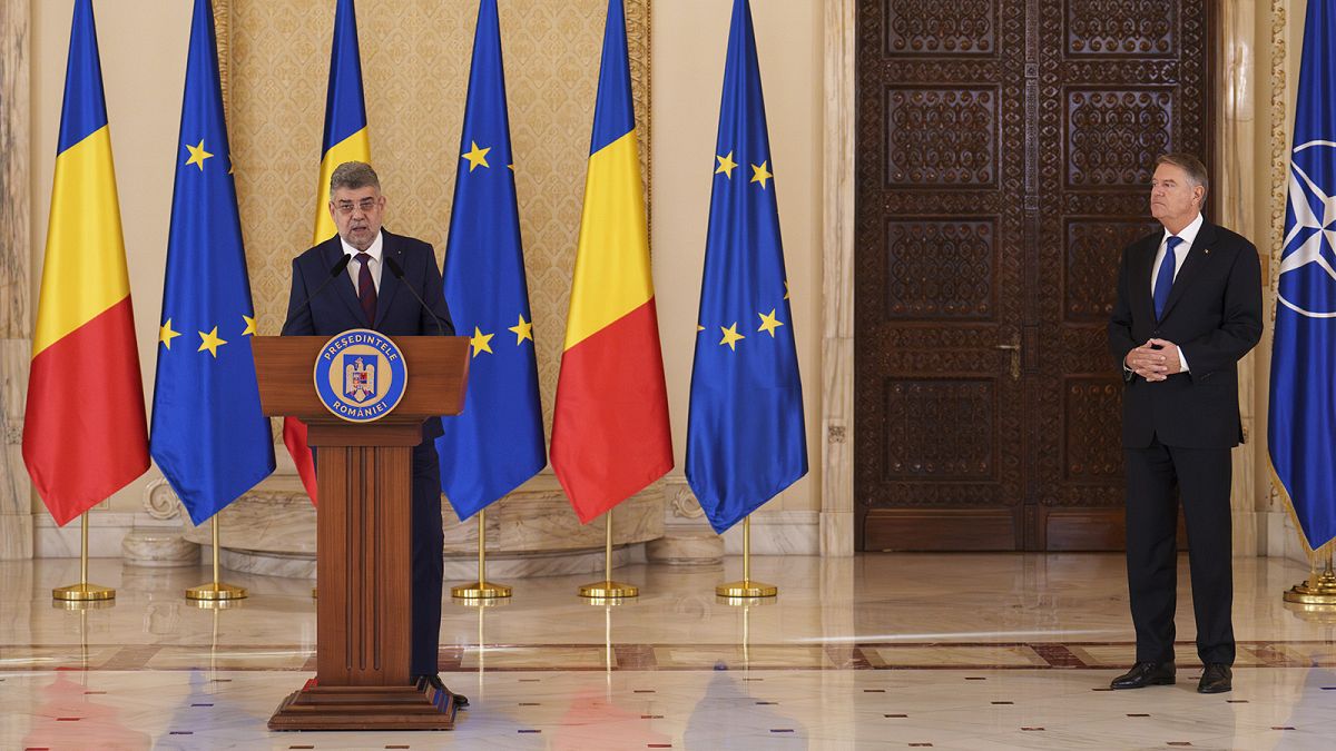 Prime Minister designate Marcel Ciolacu, left, speaks after Romanian President Klaus Iohannis, right, nominated him to form the new government in Bucharest, 23 December 2024