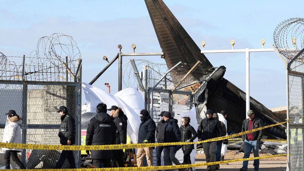 Experts from the U.S. National Transportation Safety Board (NTSB) and joint investigation team between the U.S. and South Korea check the site of a plane crash, 31 Dec 2024.