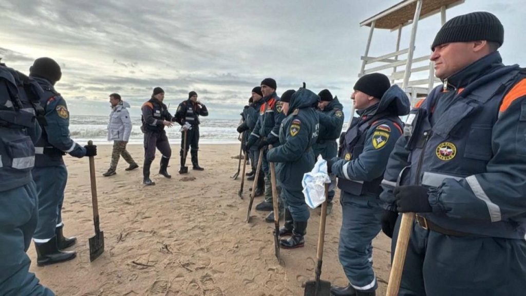 Rescuers clean the coast after oil stains from two Russian tankers washed ashore in the Krasnodar region in Russia, 17 December, 2024.