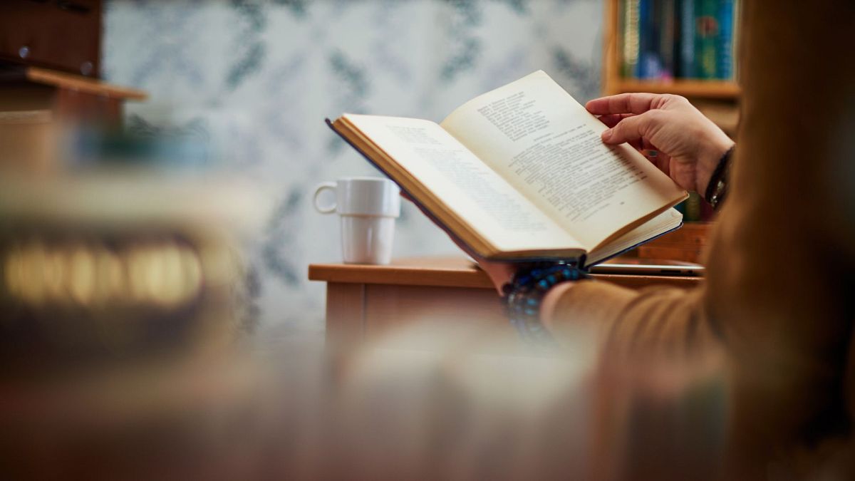 A woman reads a climate book