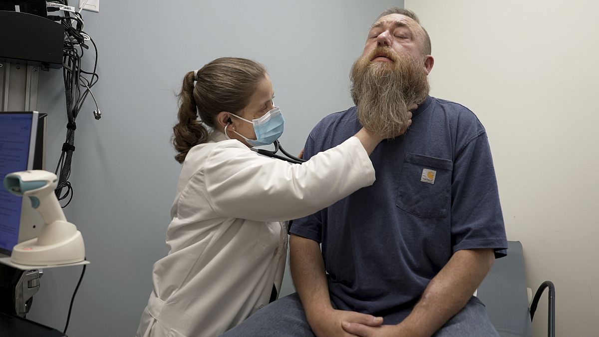 Dr Silke Niederhaus exams patient Eric Lyons at the University of Maryland in the US in May 2024.