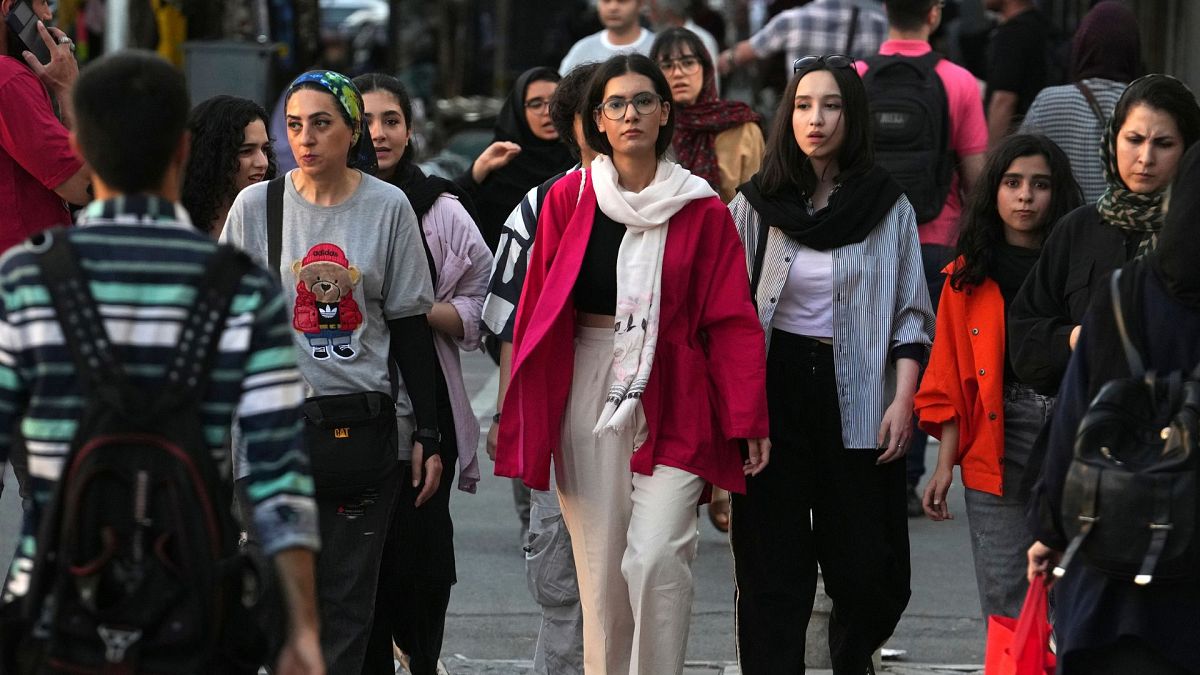 Iranian women, some without wearing their mandatory Islamic headscarves, walk in downtown Tehran, Iran, Saturday, 9 September 2023.