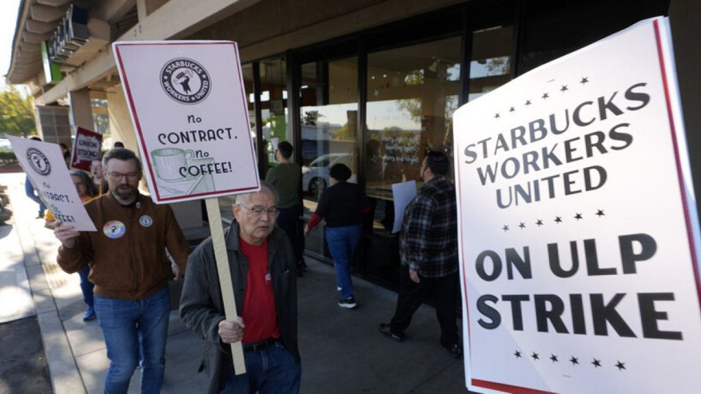 Starbuck workers picket outside of a closed Starbucks on Friday, Dec. 20, 2024, in Burbank, California