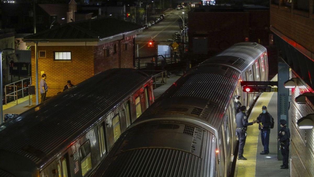 FILE PHOTO: New York Police officers clear a train at the Coney Island Stillwell Avenue Terminal, May 5, 2020, in the Brooklyn borough of New York.