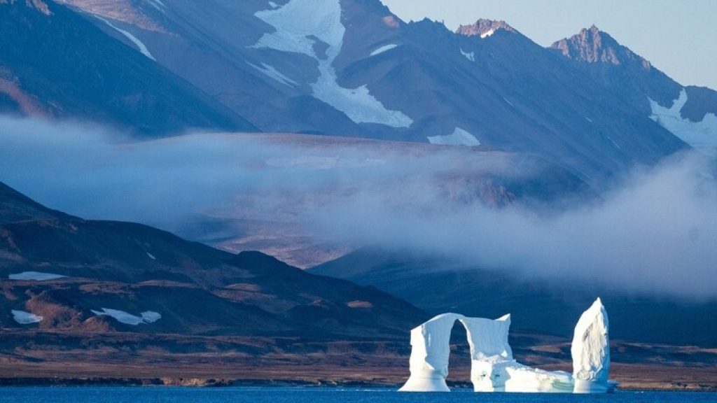 An iceberg floats in the Scoresby Sund, Tuesday, Sept. 12, 2023, in Greenland.