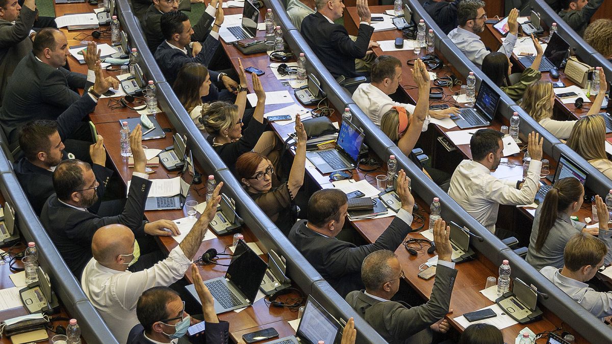 FILE: Kosovo lawmakers vote during the parliament session in Pristina, 7 July 2021