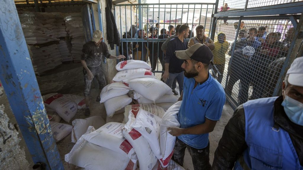 Donated flour is distributed to Palestinians at an UNRWA centre in the Nuseirat refugee camp, 3 December, 2024