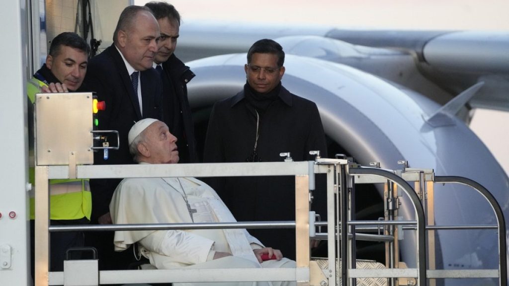 Pope Francis boards an airplane at Rome