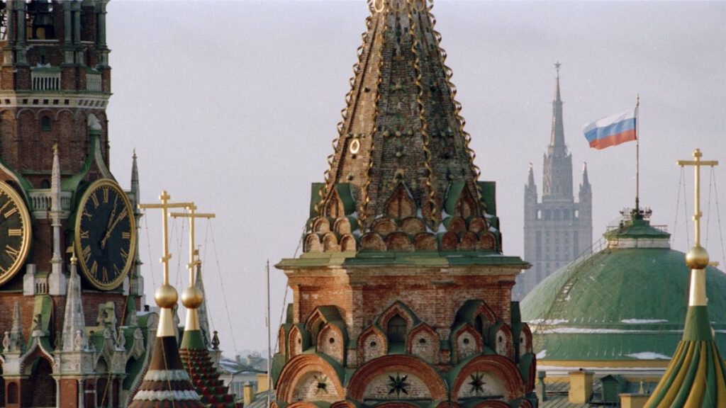 FILE PHOTO: The Russian flag flies over the Kremlin between the spires of St. Basil