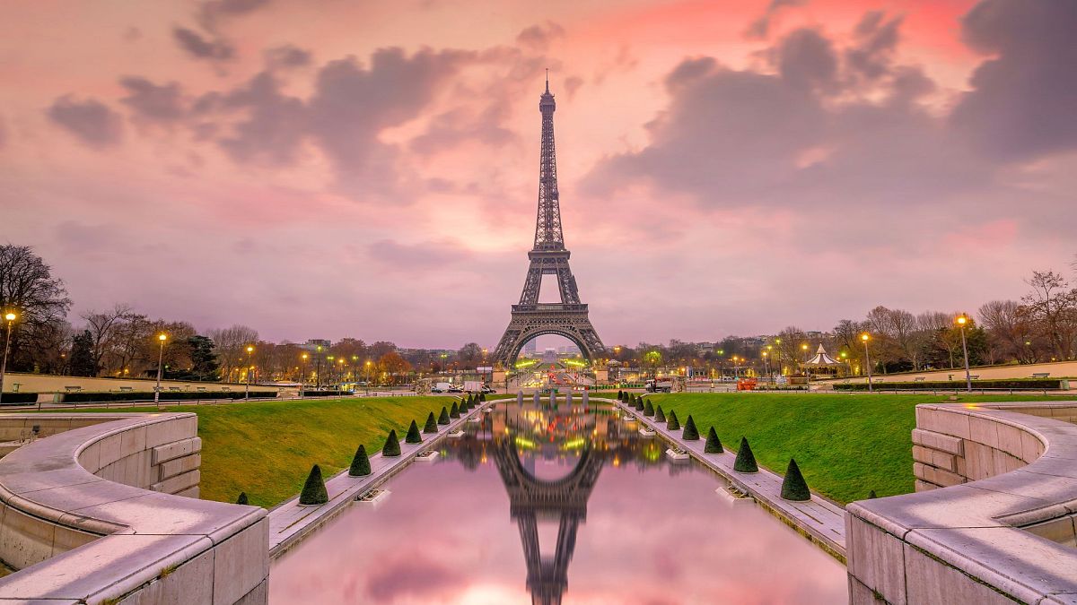 The Eiffel Tower at sunrise in Paris, France.