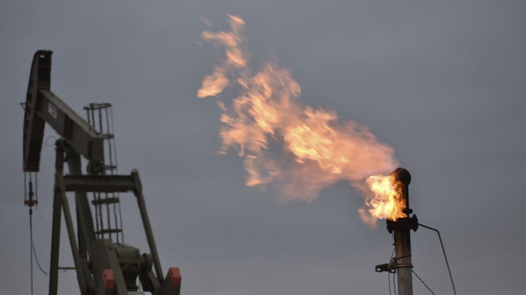 A flare for burning excess methane, or natural gas, from crude oil production at a well pad at North Dakota in the US