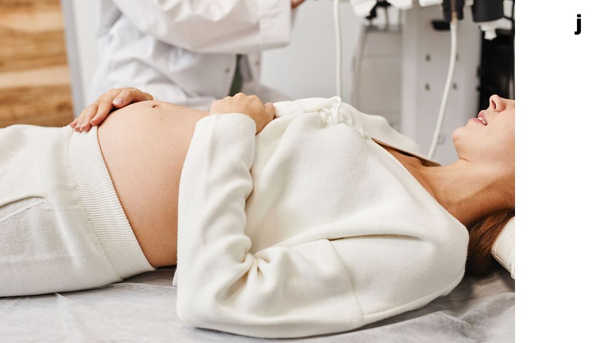 A pregnant woman prepares for an ultrasound.