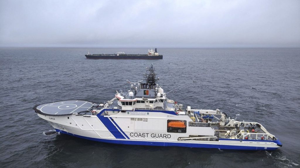 Oil tanker Eagle S, background, and the Finnish Border Guard ship Turva at sea outside Porkkalanniemi, Finland, Dec. 26, 2024,