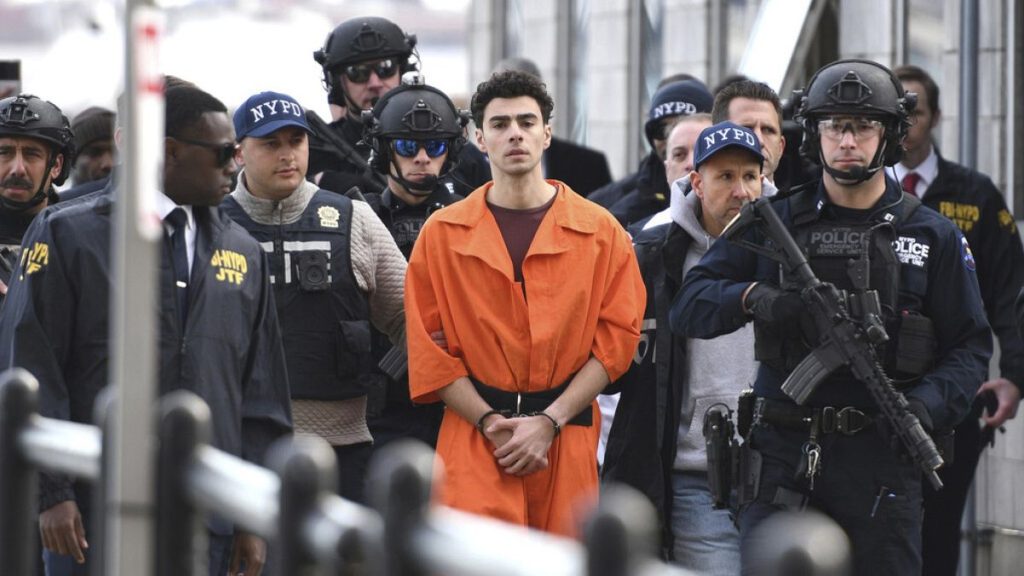 Luigi Mangione, charged with the fatal shooting of UnitedHealthcare CEO Brian Thompson, is escorted by police in New York, Dec. 19, 2024.