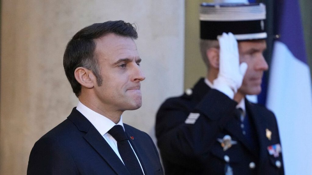 French President Emmanuel Macron waits for President-elect Donald Trump to arrive at the Elysee Palace, Saturday, Dec. 7, 2024 in Paris.