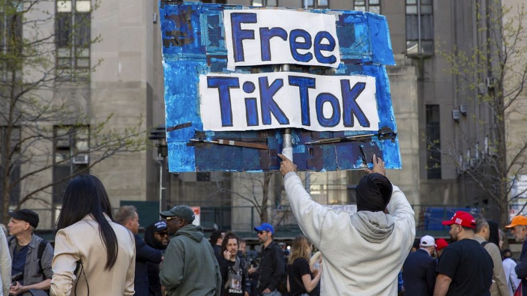 FILE - A man carries a Free TikTok sign in front of the courthouse where the hush-money trial of Donald Trump was underway on April 15, 2024, in New York.