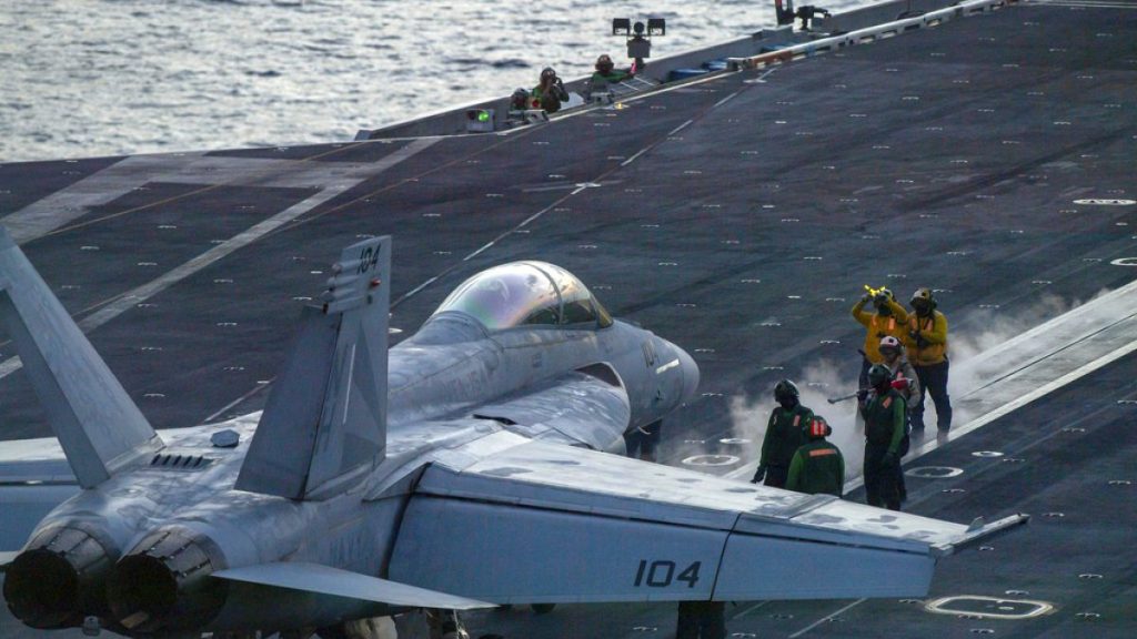 FILE - An F/A-18 Super Hornet prepares to launch off the flight deck of the Nimitz-class aircraft carrier USS Theodore Roosevelt  onJuly 5, 2024, in the South China Sea.