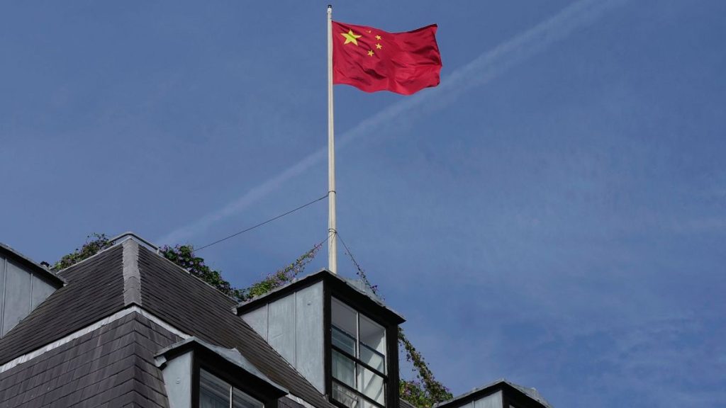 A Chinese national flag is raised at the Chinese embassy in London, Monday, 11 September 2023.