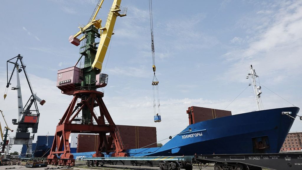 FILE: A crane unloads metal rolls from cargo ship Kholmogory arrived from St Petersburg at the port of Kaliningrad, 30 June 2022