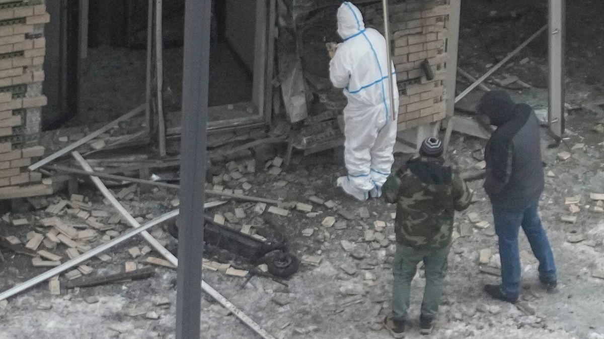 Investigators work near a scooter at the place where Kirillov and his assistant were killed by an explosive device on 17 December, 2024.