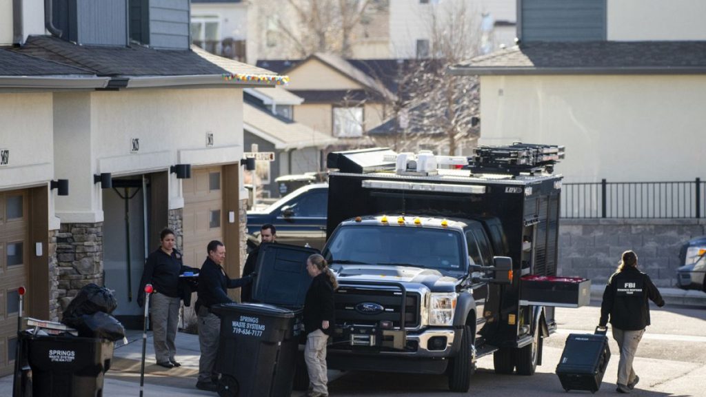 Investigators search a townhouse in northeastern Colorado Springs, Colo., Thursday, Jan. 2, 2025, as the investigation connected to the explosion of a Tesla Cybertruck outside