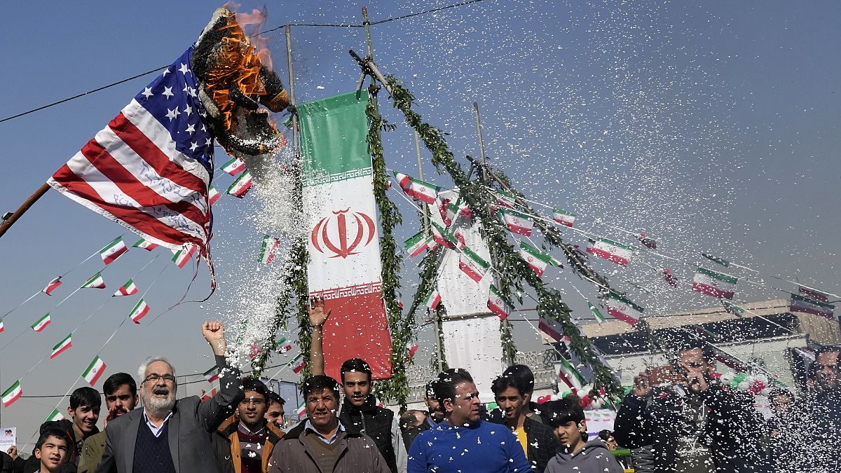 Demonstrators burn a US flag during their annual rally commemorating Iran