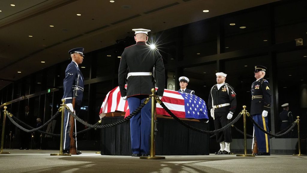 The Guard of Honor surrounds the casket of former President Jimmy Carter as he lies in repose at the Jimmy Carter Presidential Library and Museum in Atlanta, 4 January, 2025