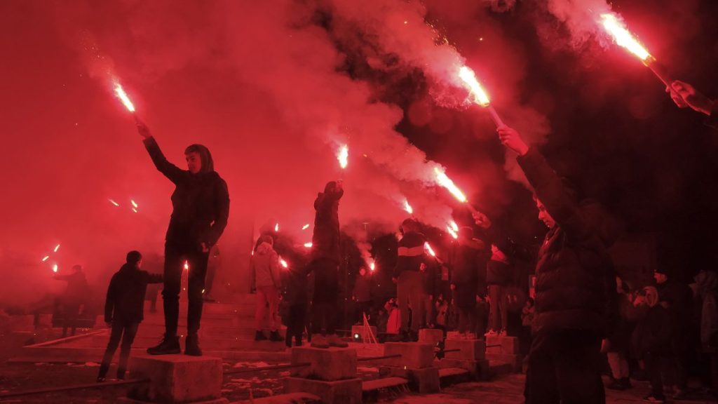 Children light torches during a protest demanding the resignations of top security officials over a shooting earlier this week in Cetinje, 5 January, 2025