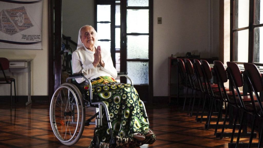 In this photo released by LongeviQuest, Sister Inah Canabarro, 115, puts her hands together in prayer, in Porto Alegre, Brazil, Friday, February 16, 2024.