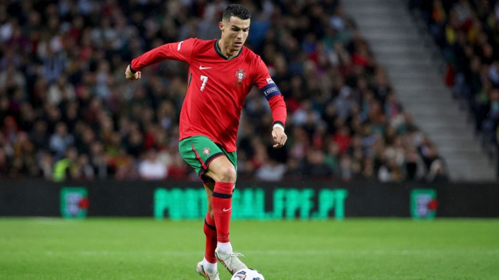 Cristiano Ronaldo runs with the ball during the UEFA Nations League soccer match between Portugal and Poland at the Dragao stadium in Porto, Portugal, Friday, Nov. 15, 2024.