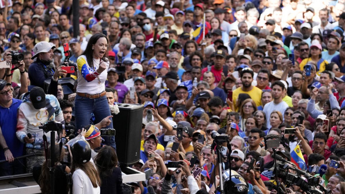 Opposition leader Maria Corina Machado addresses supporters during a protest against Venezuelan President Nicolas Maduro the day before his inauguration for a third term