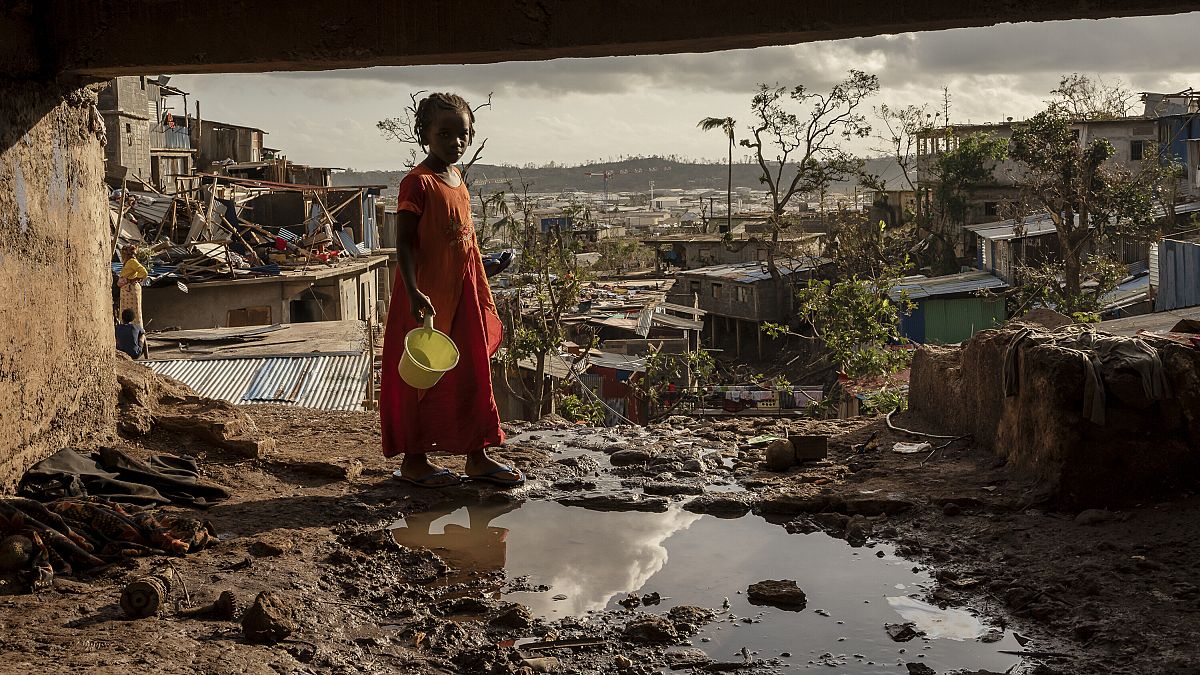 A young girl walks in the Kaweni slum on the outskirts of Mamoudzou after Cyclone Chido hit, 19 December, 2024