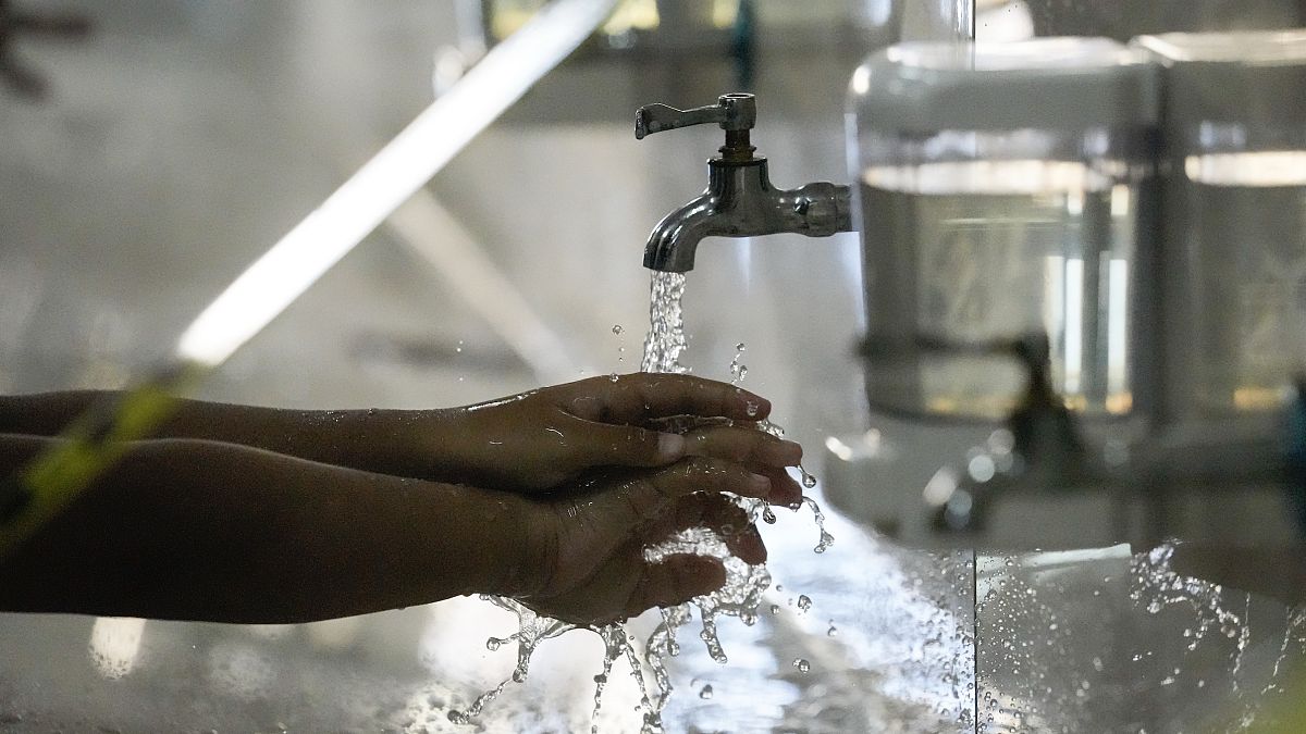 A student washes hands as part of health protocols during COVID-19 outbreak in Makati city, Philippines on Monday, Dec. 6, 2021. (File Photo)