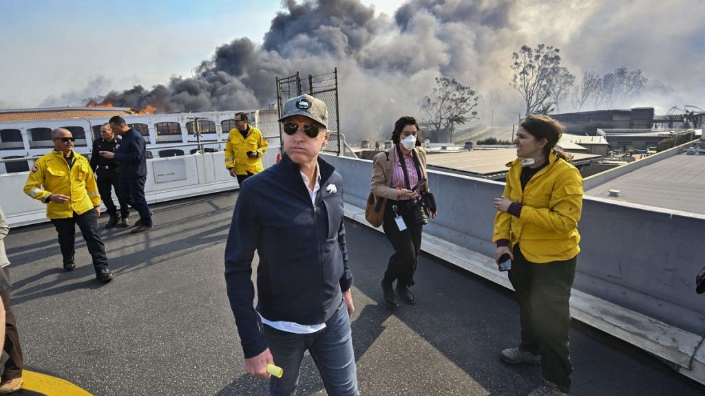 California Governor Gavin Newsom surveys damage in during the Palisades Fire on Wednesday, Jan. 8, 2025, in Pacific Palisades, Calif.