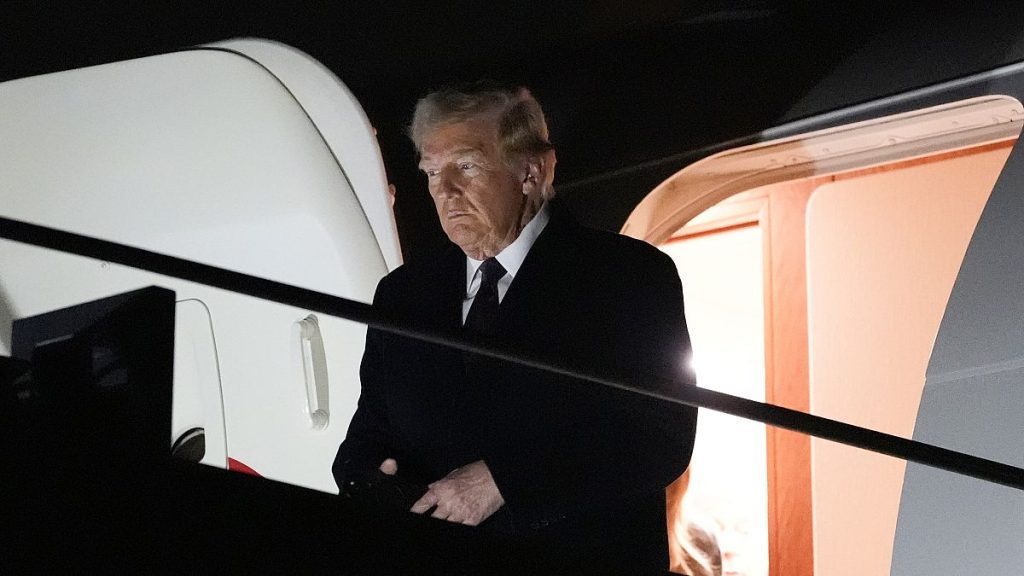 President-elect Donald Trump walks off an Air Force Special Mission airplane as he arrives at Dulles International Airport, 18 January, 2025