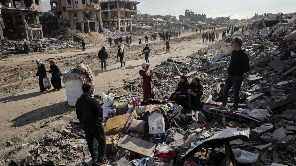 Palestinians inspect the destruction caused by the Israeli air and ground offensive in Jabaliya, 19 January, 2025